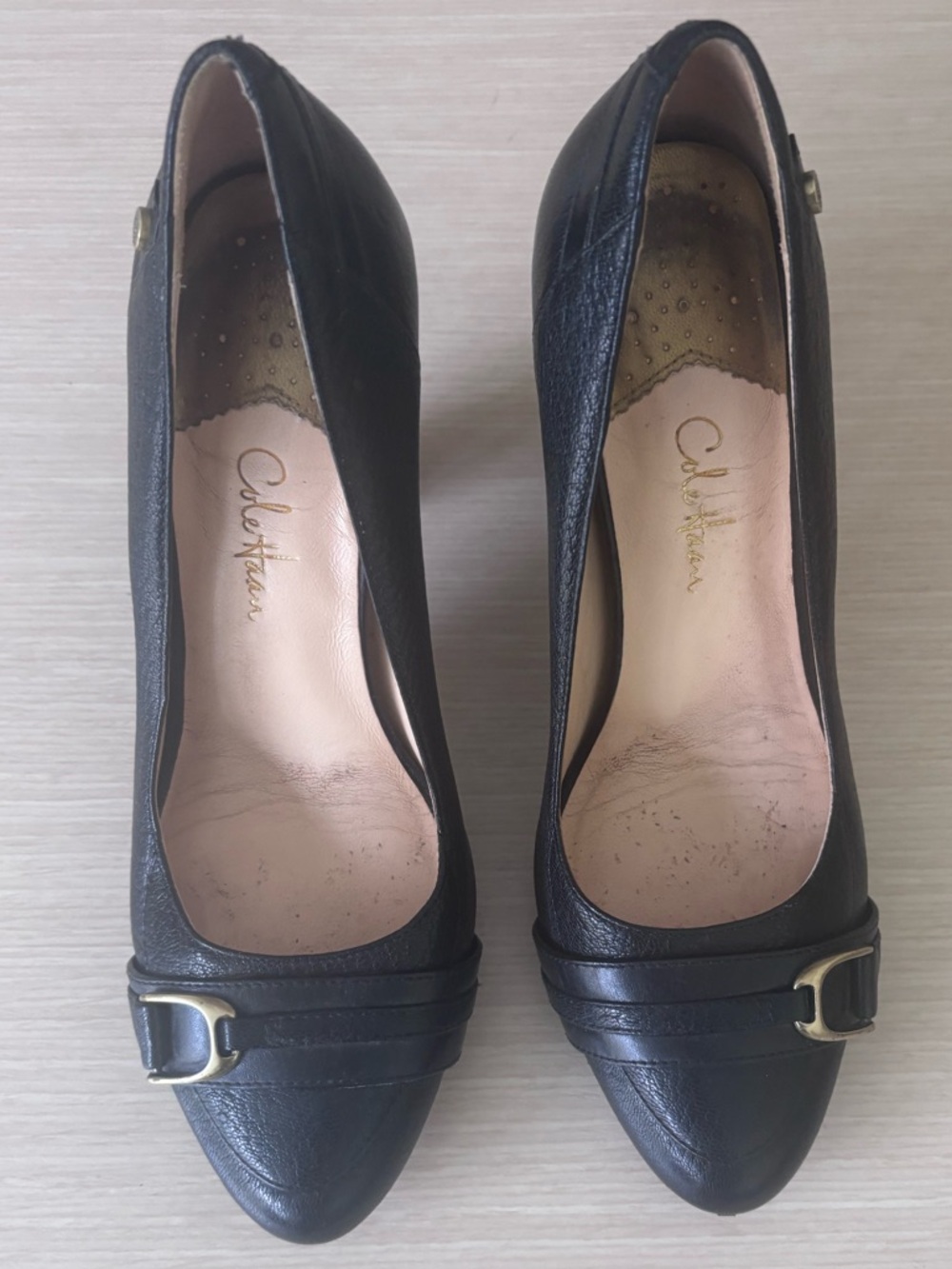 Cole Haan Black Leather Pointed-Toe Pumps with Gold Buckle Accent